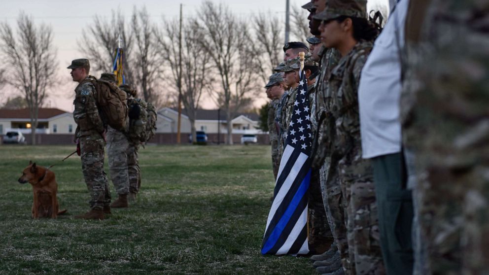 PHOTO: Participants of the 2019 377th Security Forces Squadron Suicide Awareness Ruck March stand in formation at Kirtland Air Force Base, N.M., March 29, 2019.