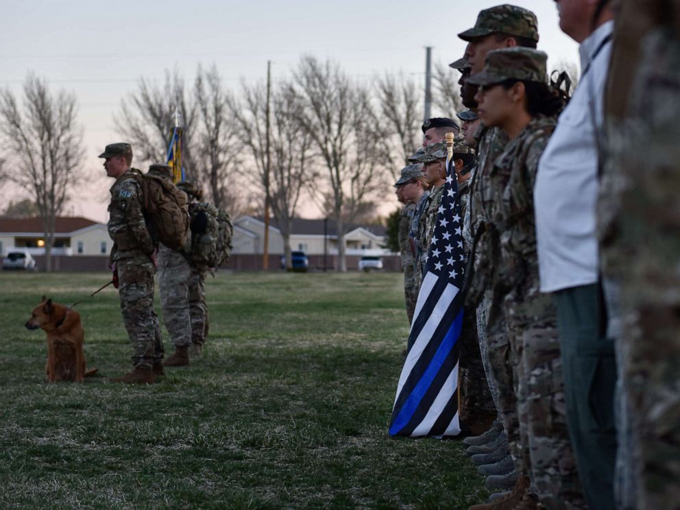 PHOTO: Participants of the 2019 377th Security Forces Squadron Suicide Awareness Ruck March stand in formation at Kirtland Air Force Base, N.M., March 29, 2019.