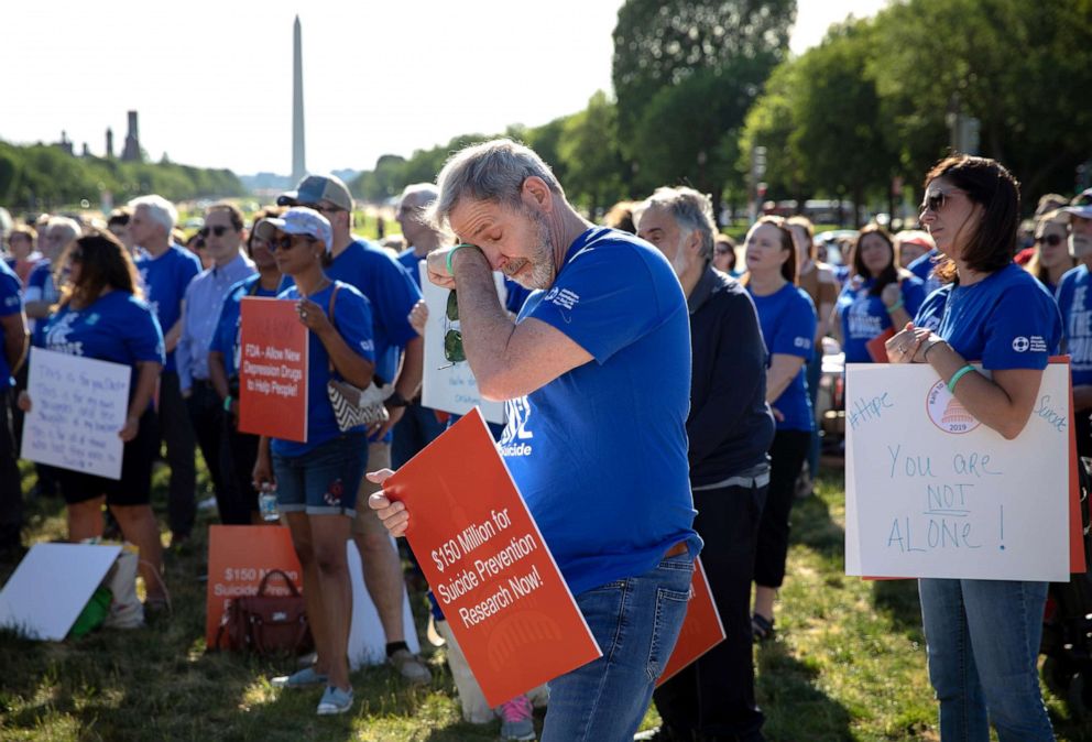 PHOTO: WPeople listen to a speaker during a rally for suicide prevention in Washington, D.C., June 11, 2019.