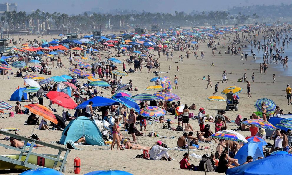PHOTO: Umbrellas take over Santa Monica Beach as people head to the shoreline to beat the heat, Sept. 5, 2021, in Santa Monica, Calif.