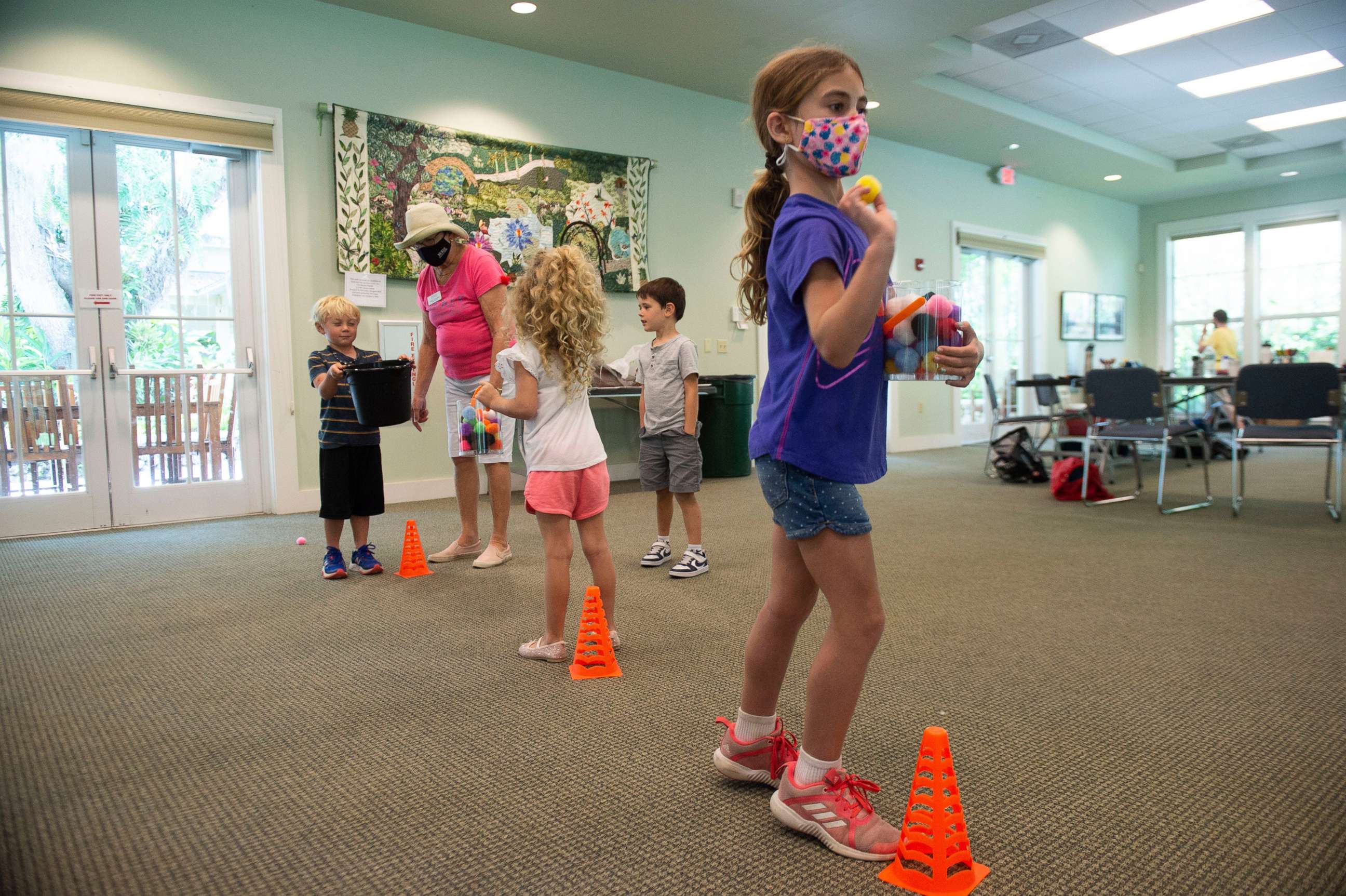 PHOTO: Campers play games while wearing Covid-19 masks at McKee Botanical Garden in Treasure Coast, Fla., March 25, 2021.