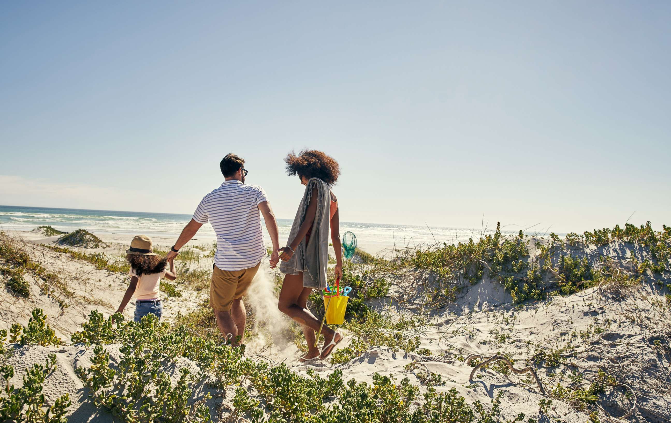PHOTO: Stock photo of shot of a family at the beach.