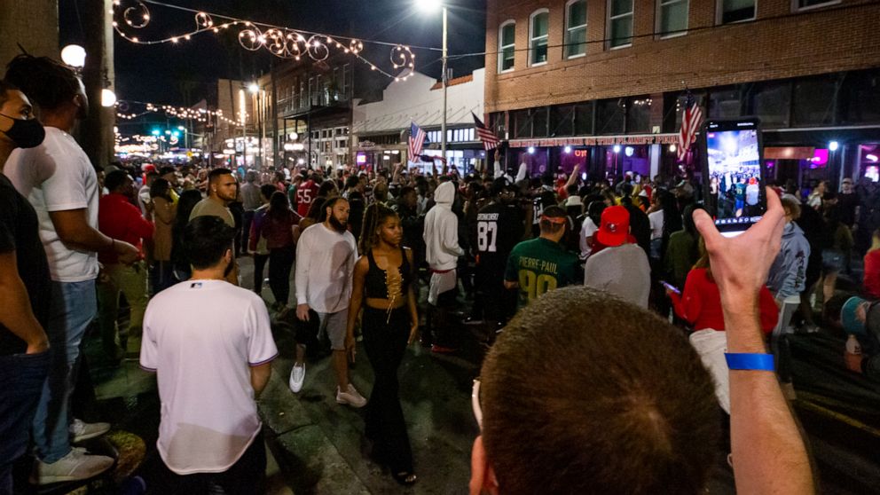 PHOTO: Fans celebrate in the streets of Ybor City in Tampa, Fla., after the Tampa Bay Buccaneers beat the Kansas City Chiefs in Super Bowl LV, Feb. 7, 2021.