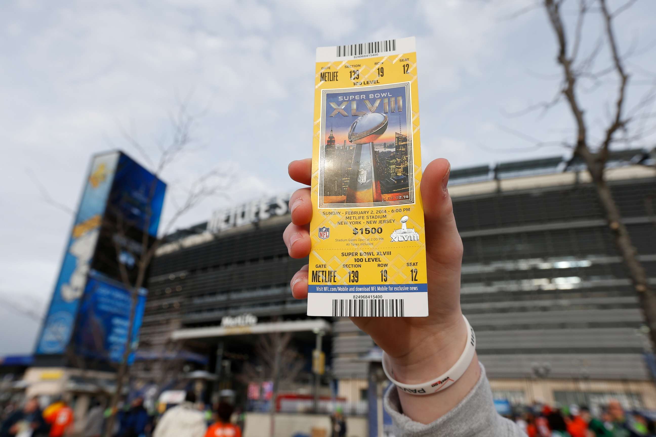 PHOTO: A fan holds his Super Bowl XLVIII ticket prior to the game between the Seattle Seahawks and the Denver Broncos in East Rutherford, N.J., Feb. 2, 2014