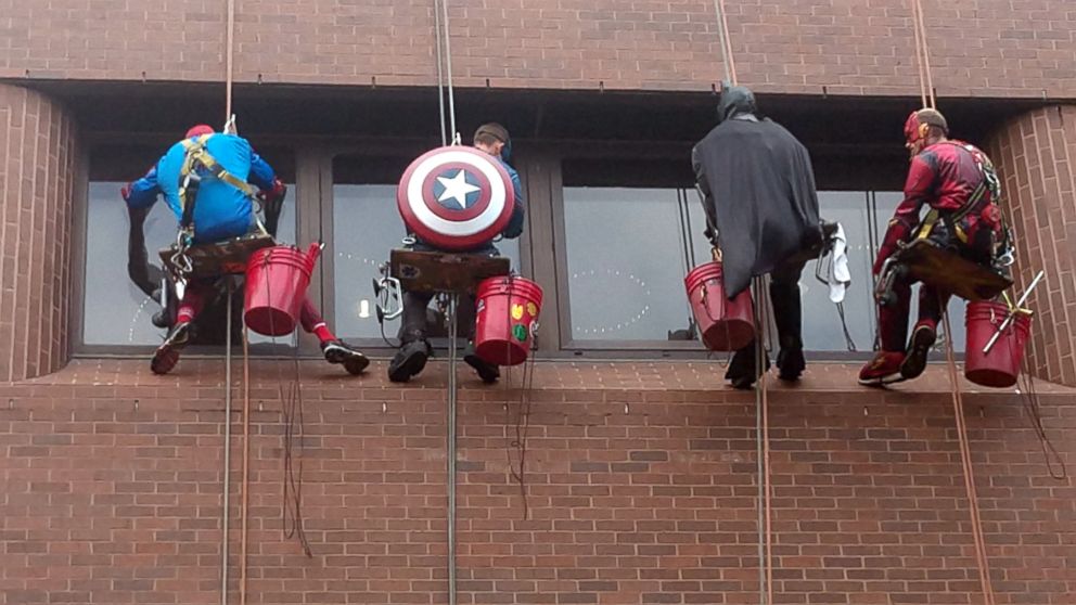 PHOTO: The volunteers rappelled down the side of Blank Children's Hospital in Des Moines, Iowa, June 26, 2018, and played games with the children as they cleaned.