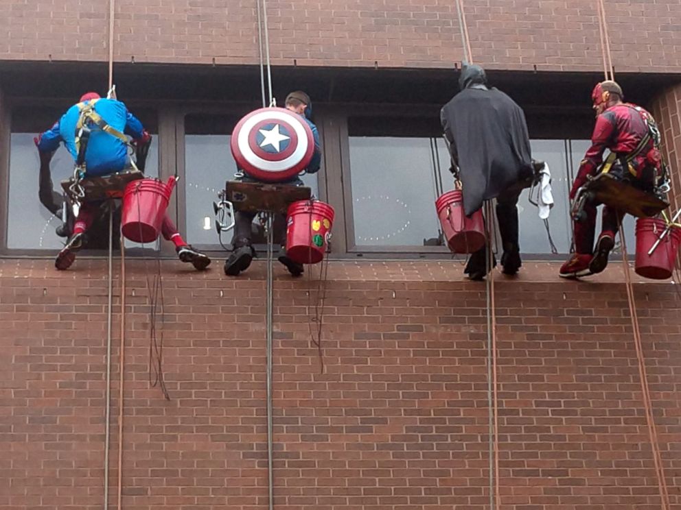 PHOTO: The volunteers rappelled down the side of Blank Childrens Hospital in Des Moines, Iowa, June 26, 2018, and played games with the children as they cleaned.