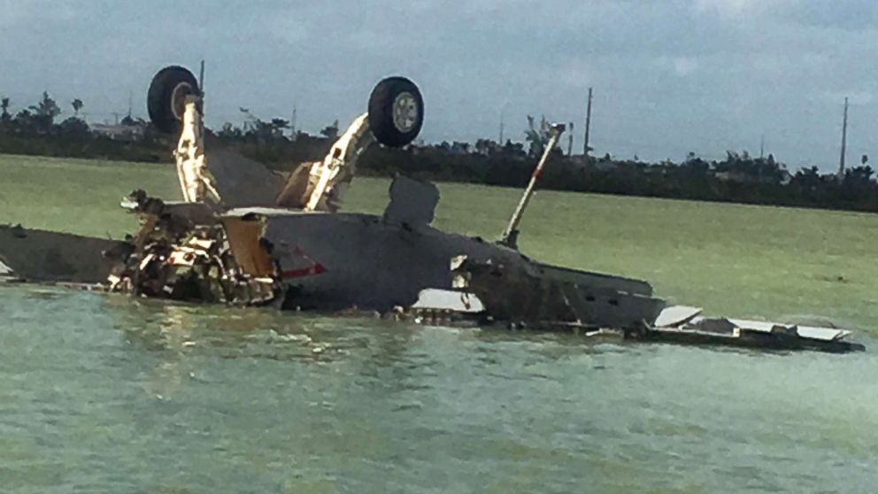 An image made from eyewitness video shows the remains of a Navy F/A-18 Super Hornet that crashed near Boca Chica Field, Naval Air Station, Key West, Fla., on March 14, 2018.