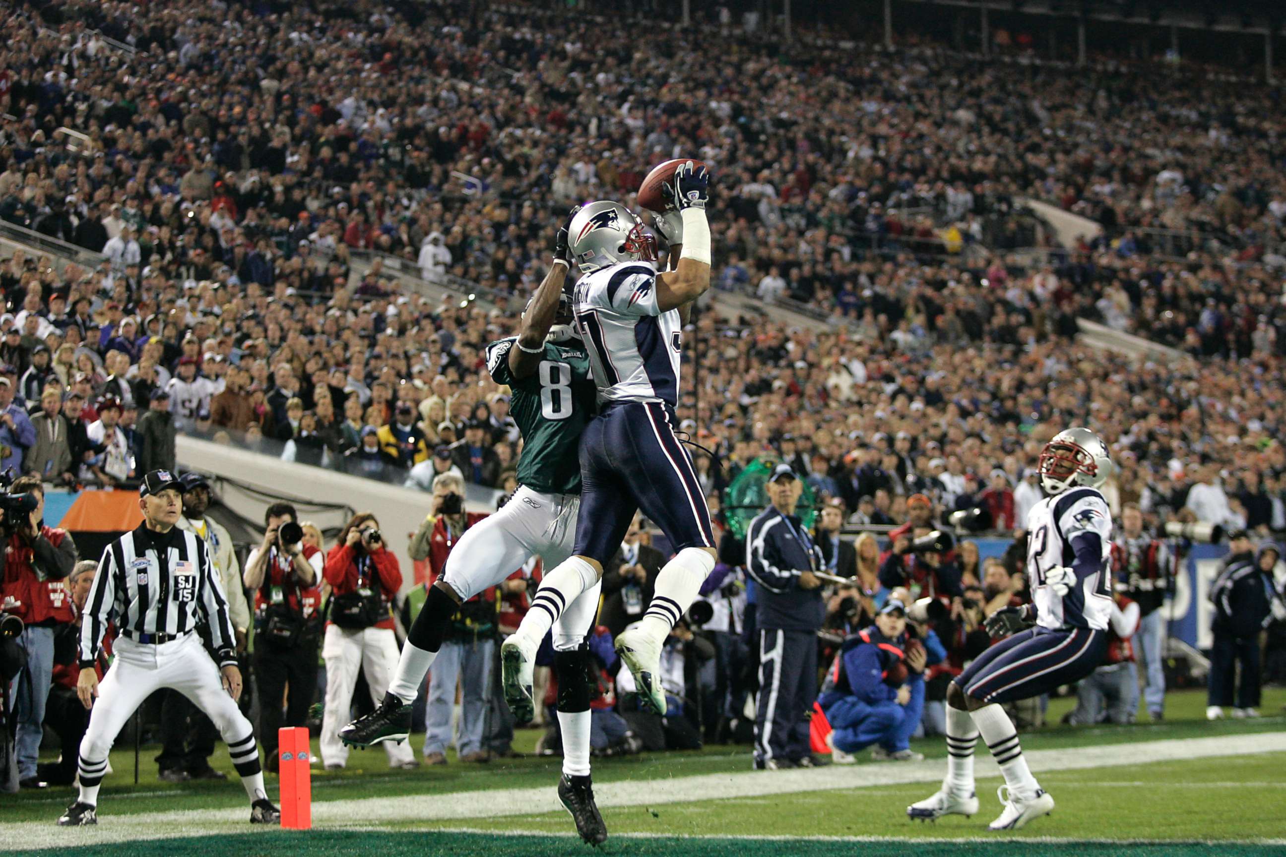 PHOTO: New England Patriots Rodney Harrison leaps in the air on an attempted interception during the NFL Super Bowl XXXIX football game against the Philadelphia Eagles in Jacksonville, Fla. Feb. 6, 2005.