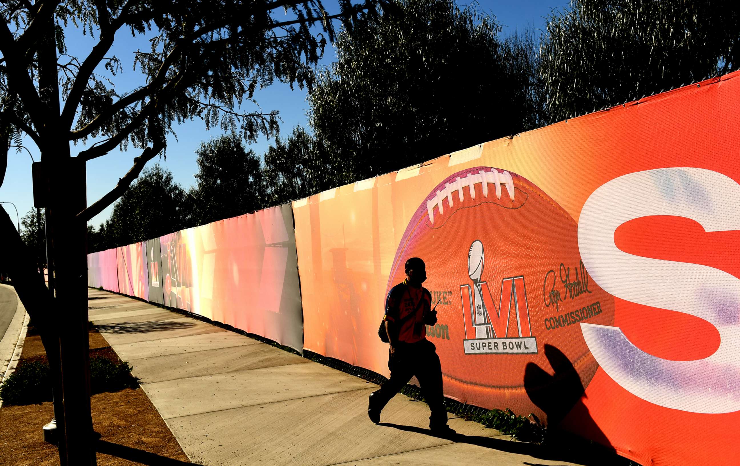 PHOTO: A security guard walks by a sign outside SoFi Stadium in Inglewood, Calif., on Feb. 7, 2022.