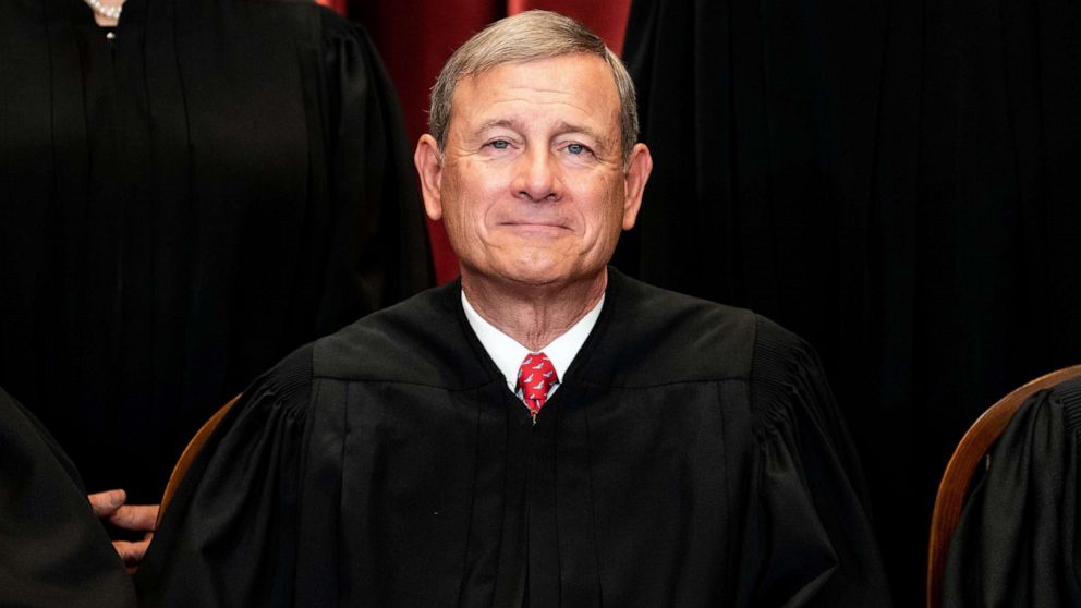 PHOTO: Chief Justice John Roberts sits during a group photo of the Justices at the Supreme Court in Washington, April 23, 2021. 
