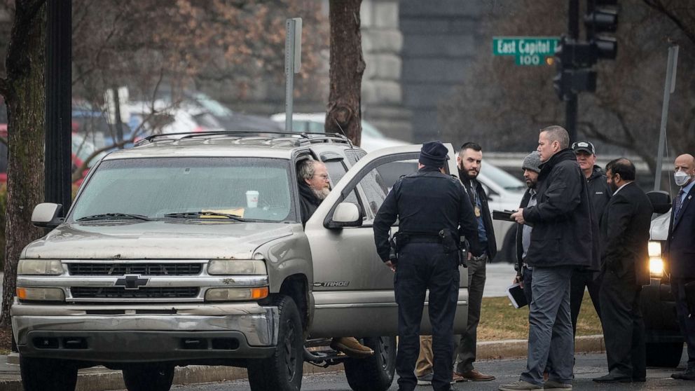 PHOTO: Parked in front of the Supreme Court illegally, a man police sources said is Dale Paul Melvin talks with U.S. Capitol Police officers, Feb. 3, 2022, in Washington, D.C.