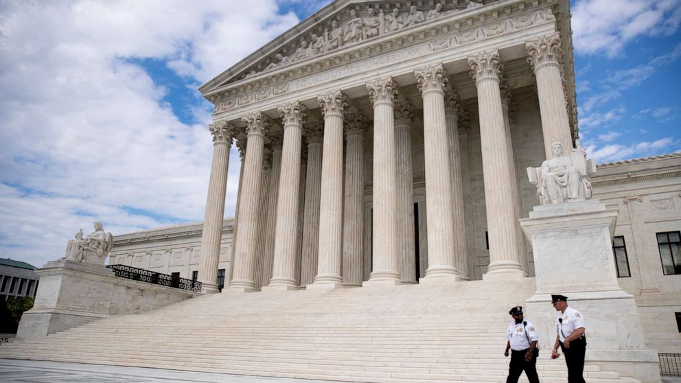 PHOTO: Security officers walk in front of the Supreme Court in Washington, May 14, 2020.