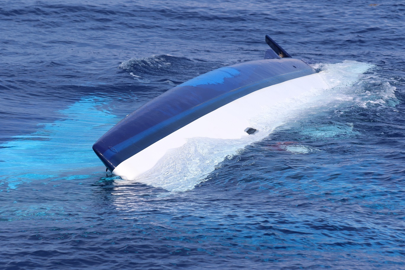 PHOTO: The 37-foot catamaran, Surf into Summer, is pictured while partially sunk, May 15, 2017 in the Florida Straits 30 miles west of Cay Sal, Bahamas.