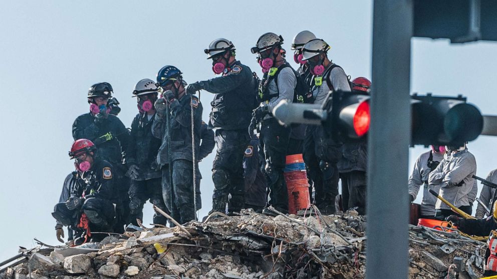 PHOTO: Search and Rescue teams look for possible survivors in the partially collapsed 12-story Champlain Towers South condo building, June 28, 2021, in Surfside, Fla. 