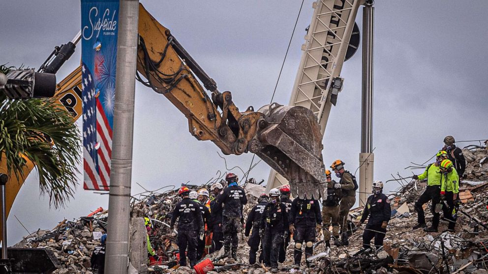 PHOTO: Search and rescue teams look for possible survivors in the rubble of the partially collapsed 12-story Champlain Towers South building, June 28, 2021, in Surfside, Fla.