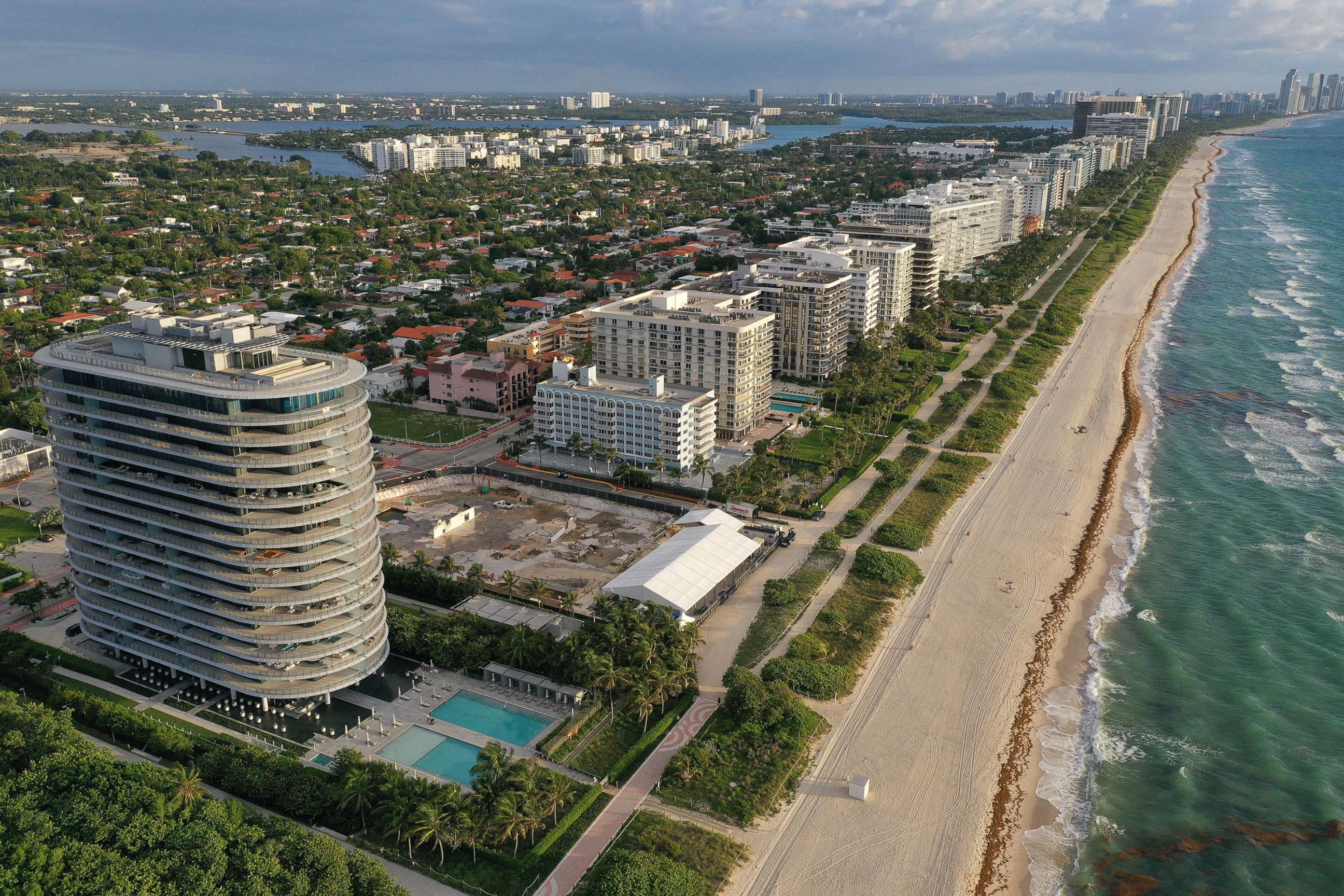 In an aerial view, a cleared lot where the 12-story Champlain Towers South condo building once stood is seen on June 22, 2022 in Surfside, Florida.