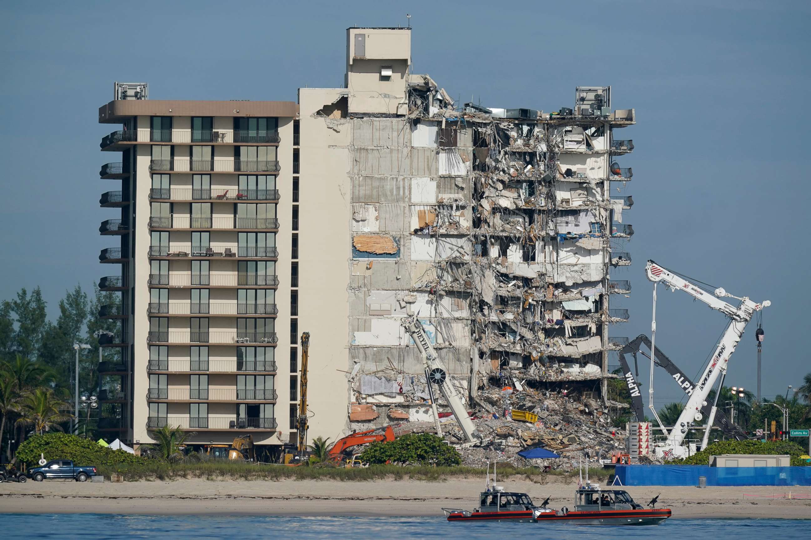 PHOTO: Coast Guard boats patrol in front of the partially collapsed Champlain Towers South condo building, July 1, 2021, in Surfside, Fla. 