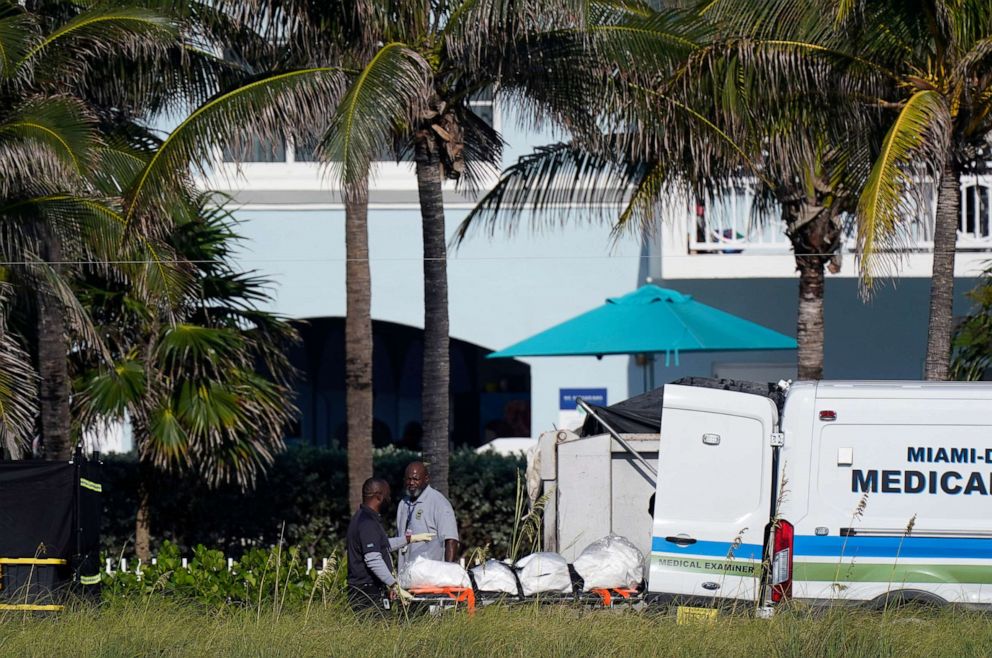 PHOTO: Workers load remains into a Miami-Dade County Medical Examiner van after they were extricated from the rubble at the Champlain Towers South condo building, more than a week after it partially collapsed, July 2, 2021, in Surfside, Fla.