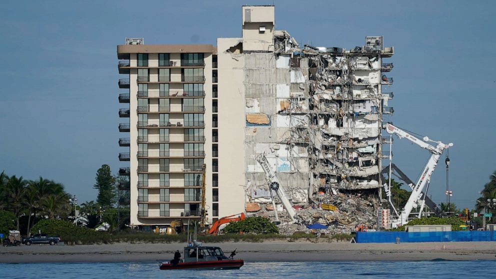 PHOTO: A Coast Guard boat patrols in front of the partially collapsed Champlain Towers South condo building, July 1, 2021, in Surfside, Fla.