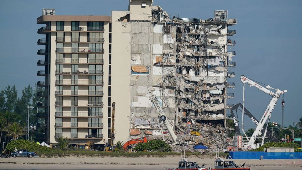 PHOTO: Coast Guard boats patrol in front of the partially collapsed Champlain Towers South condo building, ahead of a planned visit to the site by President Joe Biden, in Surfside, Fla., July 1, 2021.