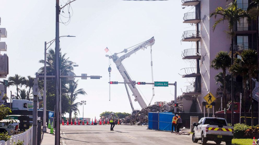 PHOTO: A construction crane stands outside the 12-story Champlain Towers South condo building that partially collapsed in Surfside, Fla.. July 4, 2021. 
