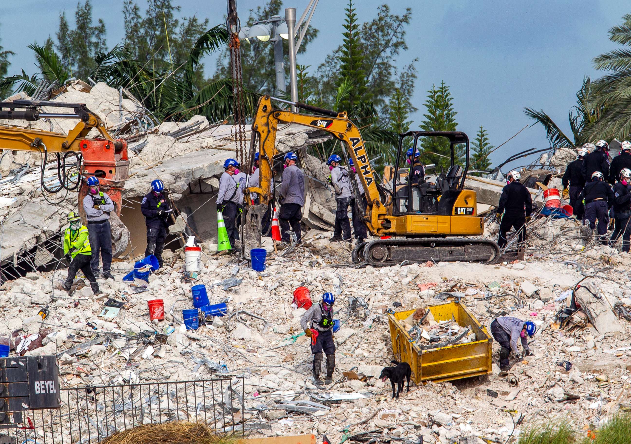 Rescuers search for victims at a collapsed South Florida condo building, July 5, 2021, in Surfside, Fla., after demolition crews set off a string of explosives that brought down the last of the Champlain Towers South building in a plume of dust on Sunday.