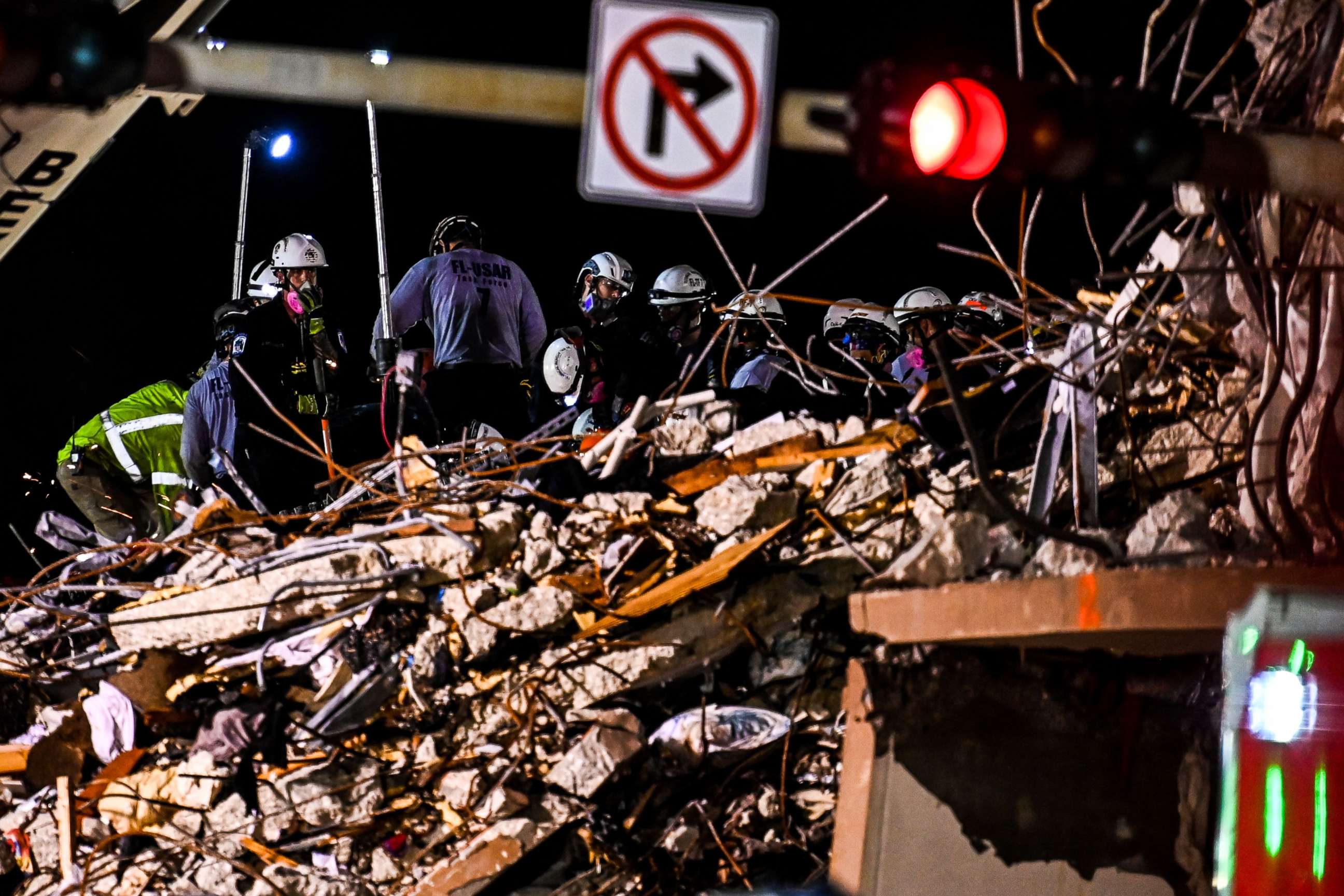 PHOTO: Search and rescue teams look for possible survivors in the partially collapsed 12-story Champlain Towers South condo building on June 30, 2021 in Surfside, Florida. 