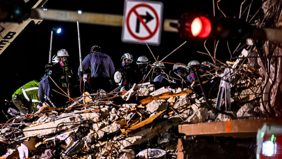 PHOTO: Search and rescue teams look for possible survivors in the partially collapsed 12-story Champlain Towers South condo building on June 30, 2021 in Surfside, Florida. 