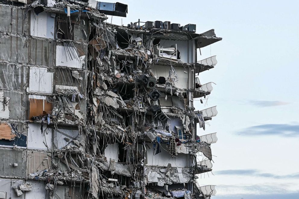 PHOTO: Rubble hangs from a partially collapsed building in Surfside north of Miami Beach, June 24, 2021.