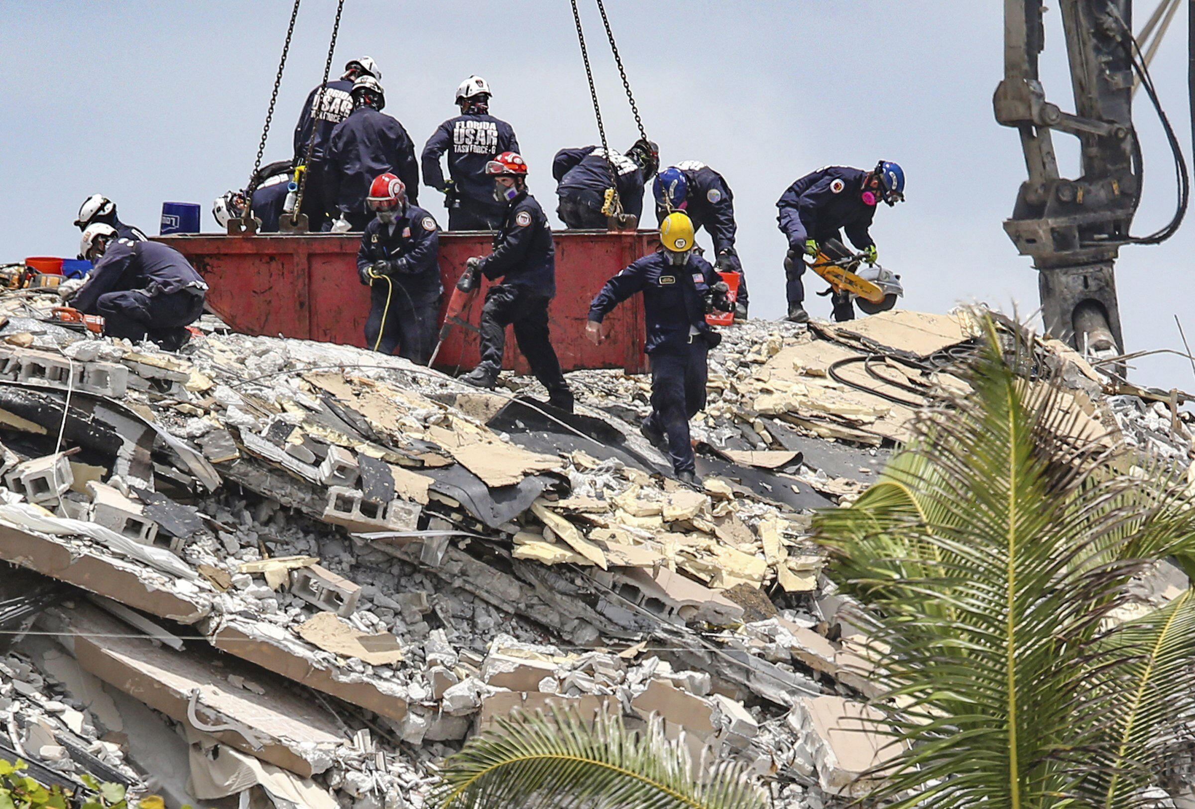 PHOTO: South Florida Urban Search and Rescue team look for survivors at the 12-story oceanfront condo, Champlain Towers South on Saturday, June 26, 2021, that partially collapsed early Thursday morning in the Surfside area of Miami.