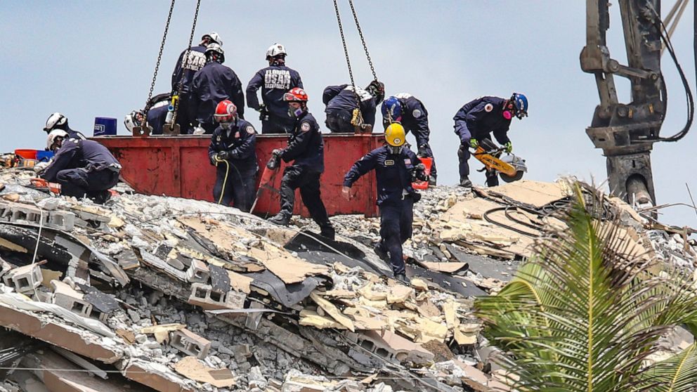 PHOTO: South Florida Urban Search and Rescue team look for survivors at the 12-story oceanfront condo, Champlain Towers South on Saturday, June 26, 2021, that partially collapsed early Thursday morning in the Surfside area of Miami.