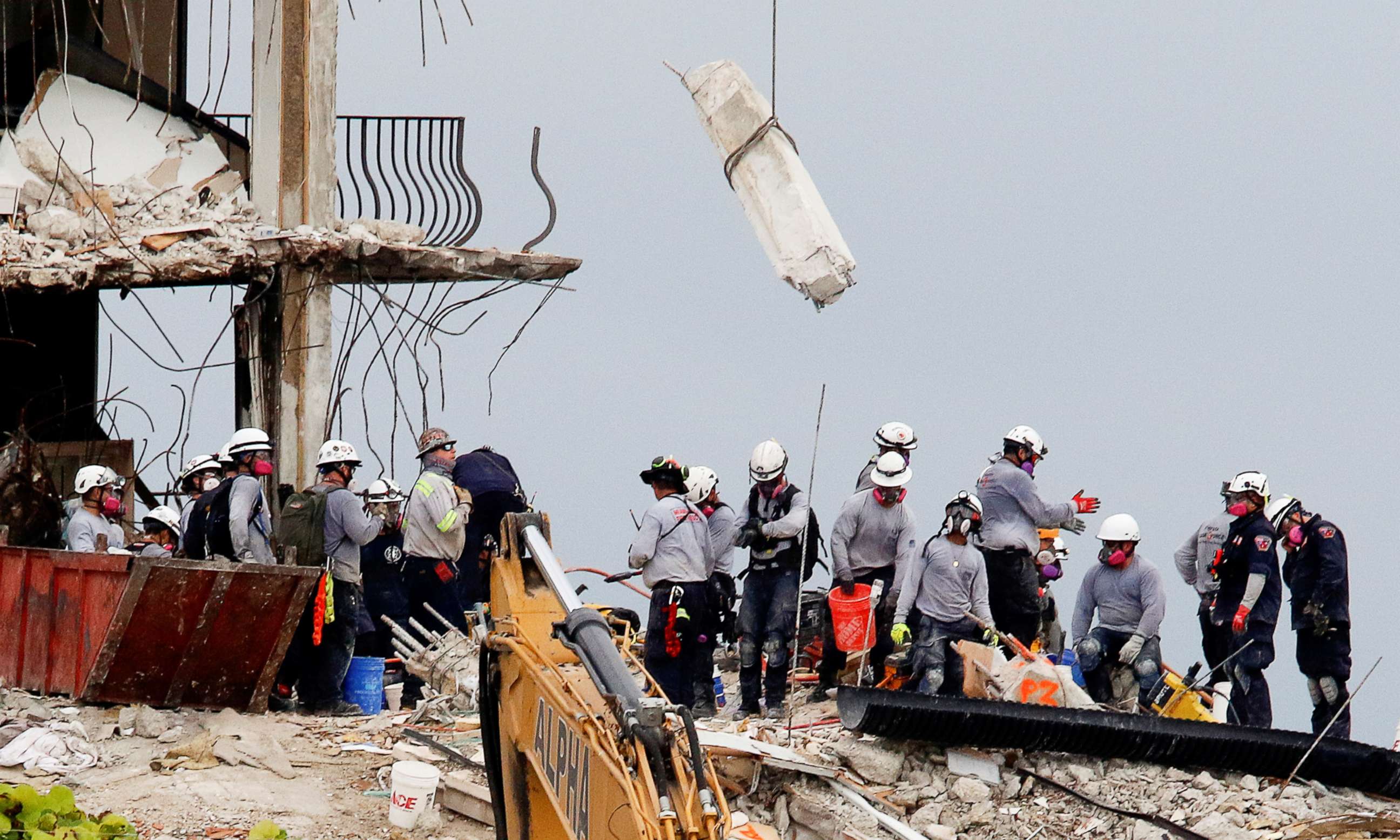 PHOTO: Emergency workers conduct search and rescue efforts at the site of a partially collapsed residential building in Surfside, near Miami Beach, Fla., June 30, 2021.