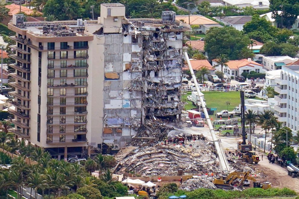 PHOTO: Workers search in the rubble at the Champlain Towers South Condo, Saturday, June 26, 2021, in Surfside, Fla.