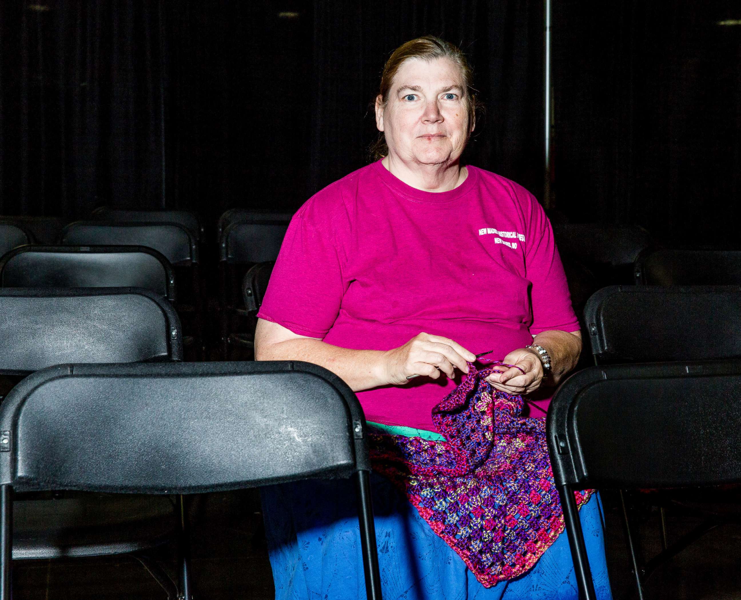 PHOTO: Kathy Pierce knits in a sitting area.