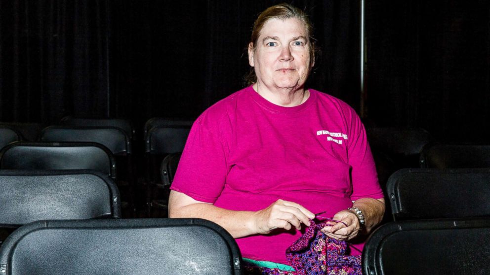 PHOTO: Kathy Pierce knits in a sitting area.