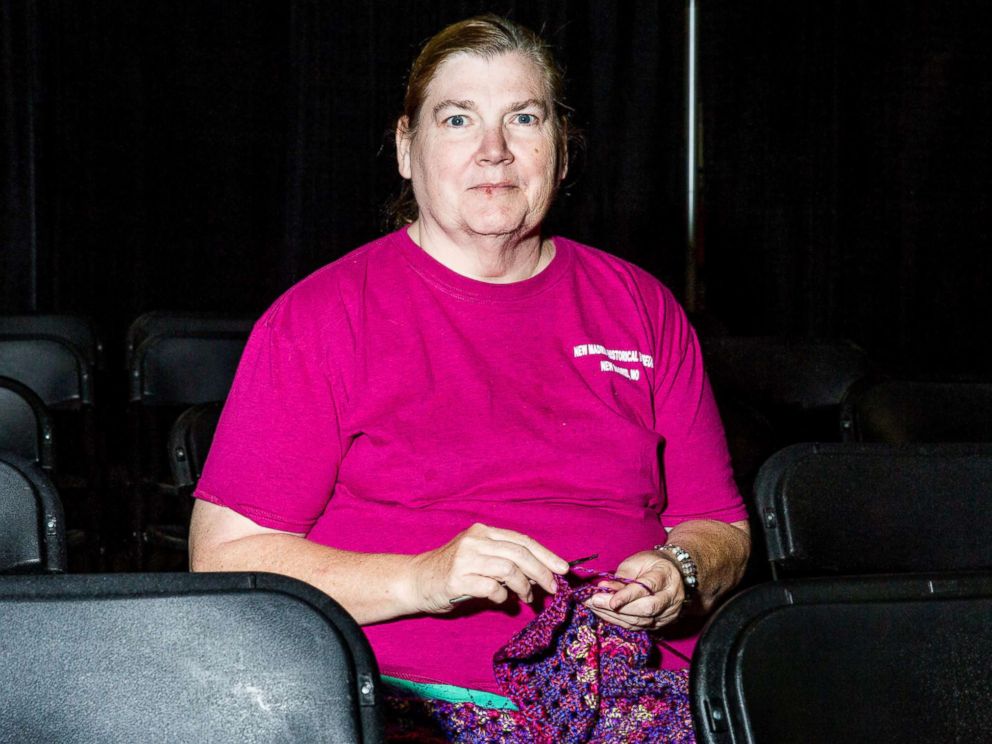 PHOTO: Kathy Pierce knits in a sitting area.