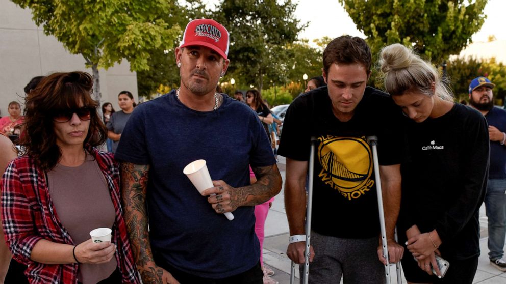 PHOTO: Survivors of the shooting at the Gilroy Garlic Festival, Shannon Gilbert, Brendon Gorshe, Nick McFarland and Sarah Ordaz, attend a vigil outside of Gilroy City Hall, in Gilroy, Calif., July 29, 2019.