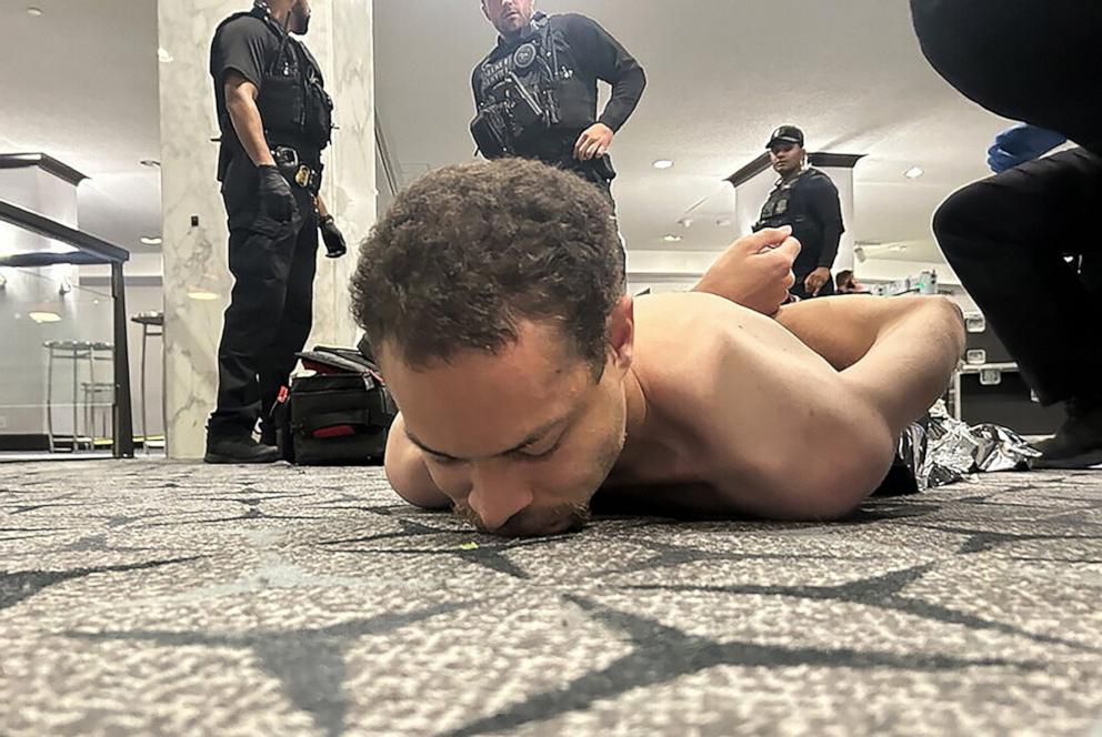PHOTO: Law enforcement detains a suspect in the shooting at the White House Correspondents' Association dinner, in Washington, April 25, 2026.