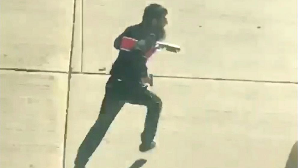 The suspect runs after crashing a truck into cyclists and pedestrians on a bike path in New York City, Oct. 31, 2017.