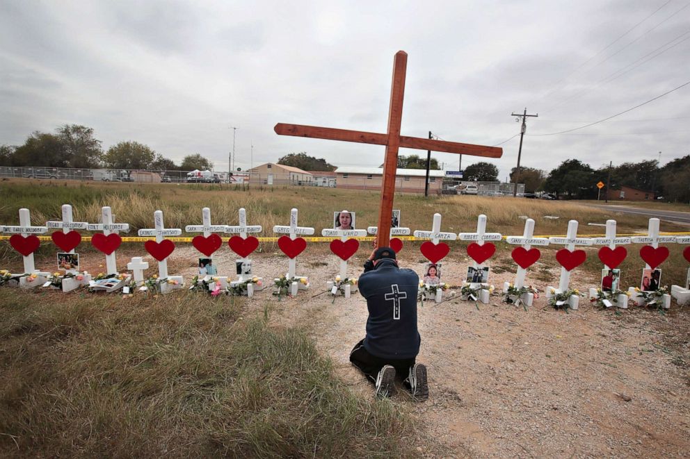 PHOTO: Joshua John of Roanoke, Va. prays at a memorial where 26 crosses were placed to honor the 26 victims killed at the First Baptist Church of Sutherland Springs on Nov. 9, 2017, in Sutherland Springs, Texas. 