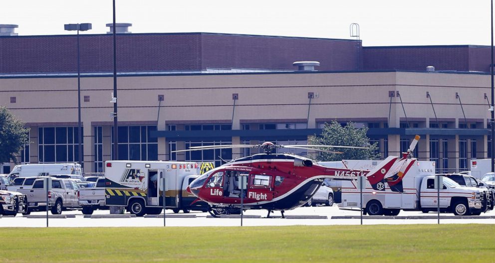 PHOTO: In this May 18, 2018, file photo, emergency crews stage in the parking lot of Santa Fe High School where at least 10 students were killed when a gunman opened fire at the high school in Santa Fe, Texas.