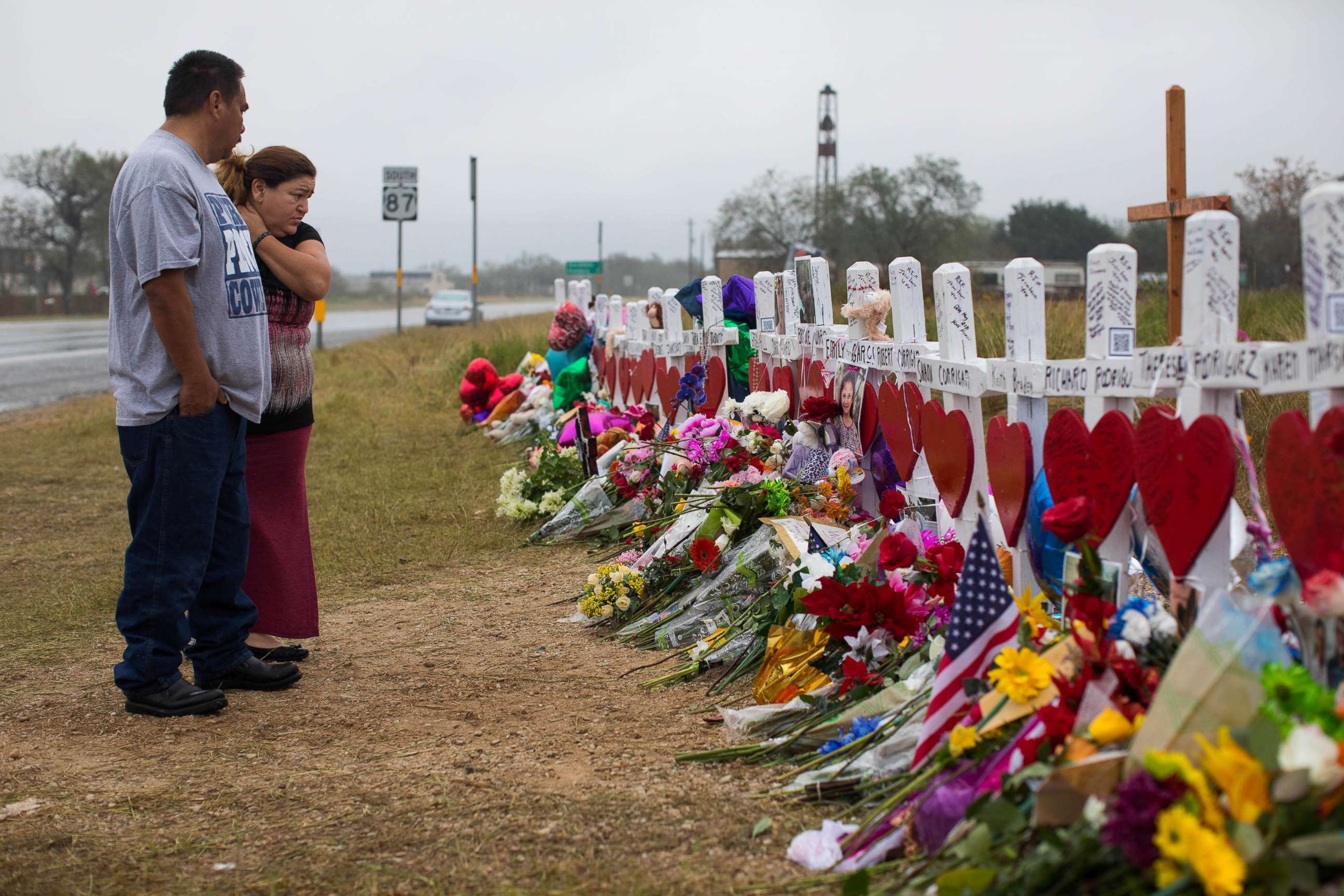 PHOTO: People visit the makeshift memorial near the First Baptist Church in Sutherland Springs, Texas, Nov. 12, 2017, honoring the 25 people including a pregnant woman whose unborn baby also died on Nov. 5, 2017. 