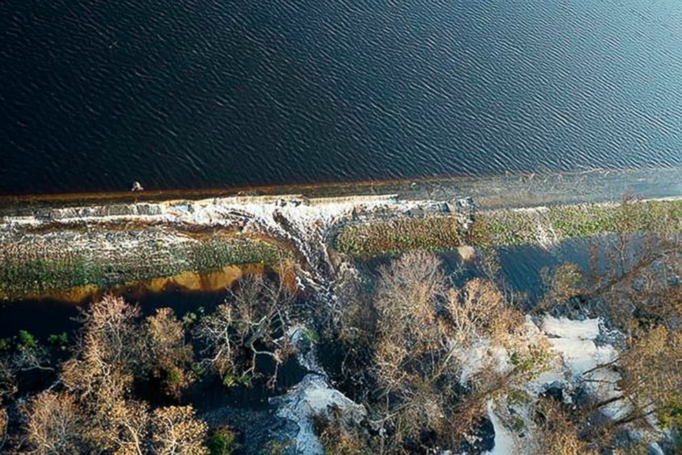 PHOTO: Gray material that Duke Energy characterized as lightweight coal combustion byproducts are seen floating on the top of the lake, near Wilmington, N.C., in a photo released by Duke Energy, Sept. 21, 2018. 