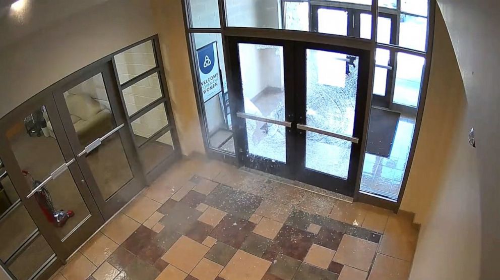 PHOTO: A still image from surveillance video shows Nashville police describe as mass shooting suspect Audrey Elizabeth Hale, firing through glass doors at an entrance to The Covenant School in Nashville, Tenn., March 27, 2023.