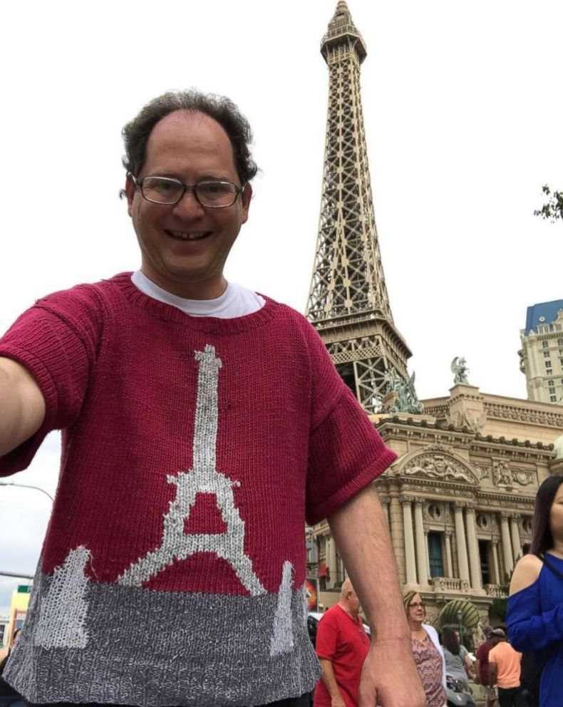 PHOTO: Sam Barsky wears his Eiffel Tower sweater standing in front of the Eiffel Towers. 