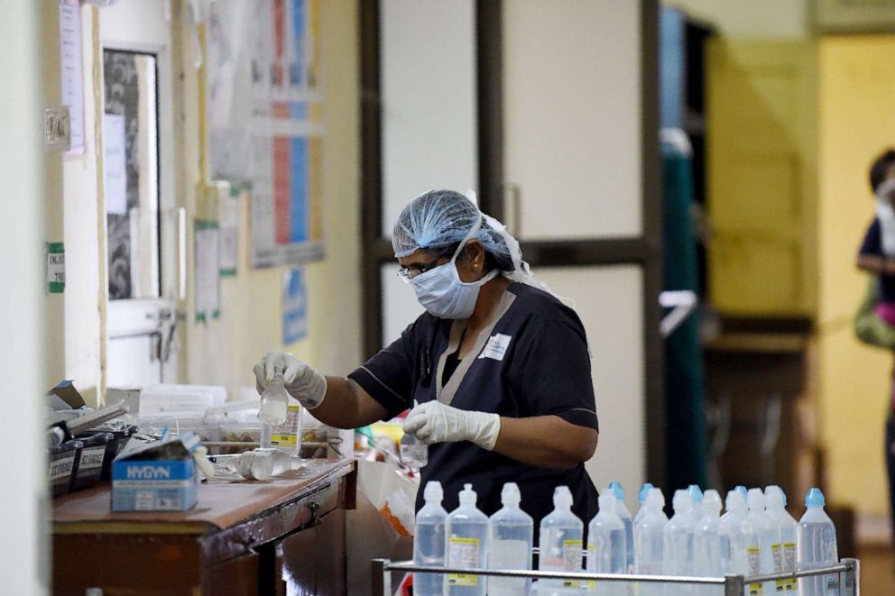 PHOTO: An Indian medical staff works at the Swine flu (H1N1) isolation ward of the Ahmedabad Civil Hospital, in Ahmedabad on August 12, 2017.