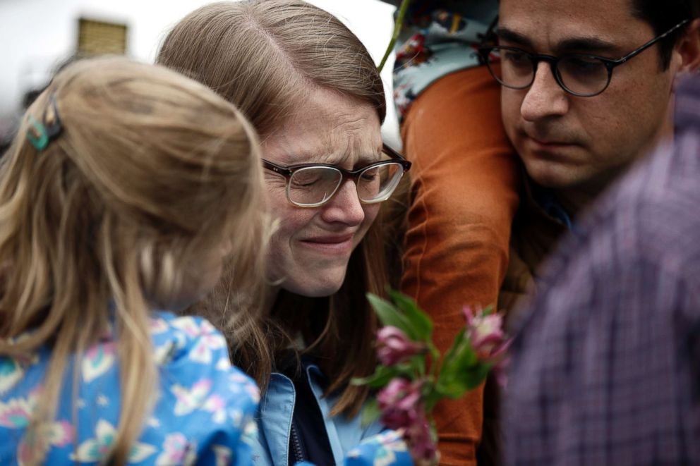 PHOTO: A woman cries as she waits to place flowers at the Tree of Life Synagogue in Pittsburgh, Oct. 28, 2018. 