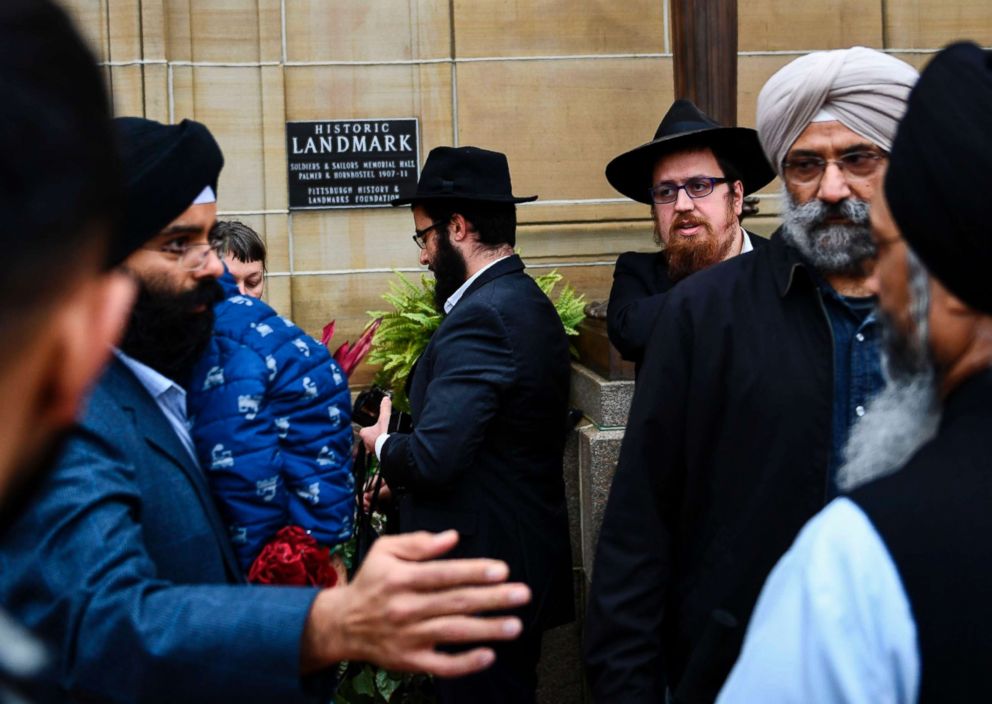 PHOTO: People arrive for a vigil, for a shooting at the Tree of Life synagogue the day before, at the Allegheny County Soldiers Memorial, Oct. 28, 2018, in Pittsburgh.