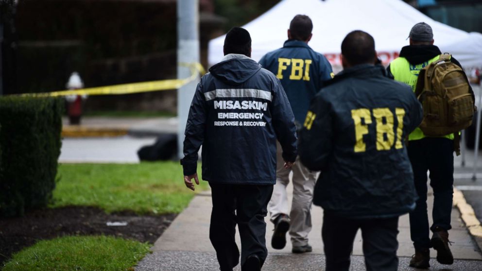 PHOTO: Members of the FBI and others survey the area, Oct. 28, 2018, outside the Tree of Life Synagogue after a fatal shooting in Pittsburgh.
