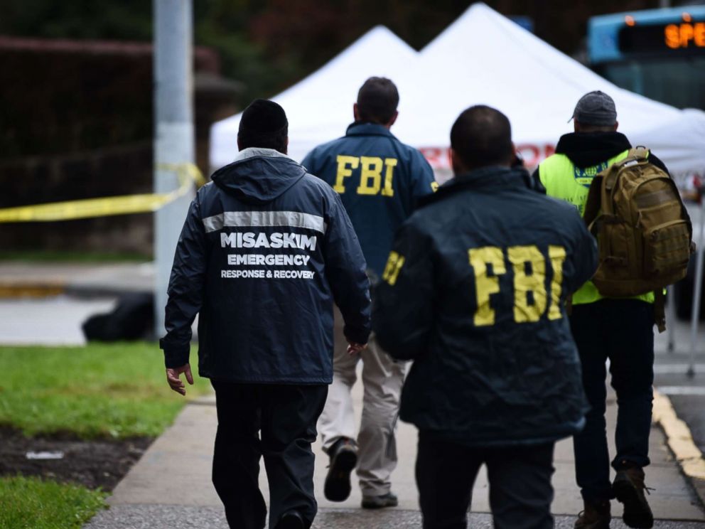 PHOTO: Members of the FBI and others survey the area, Oct. 28, 2018, outside the Tree of Life Synagogue after a fatal shooting in Pittsburgh.